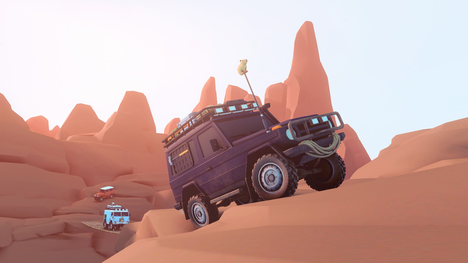 Over the Hill: Ein Allradfahrzeug kraxelt durch eine rote Felslandschaft