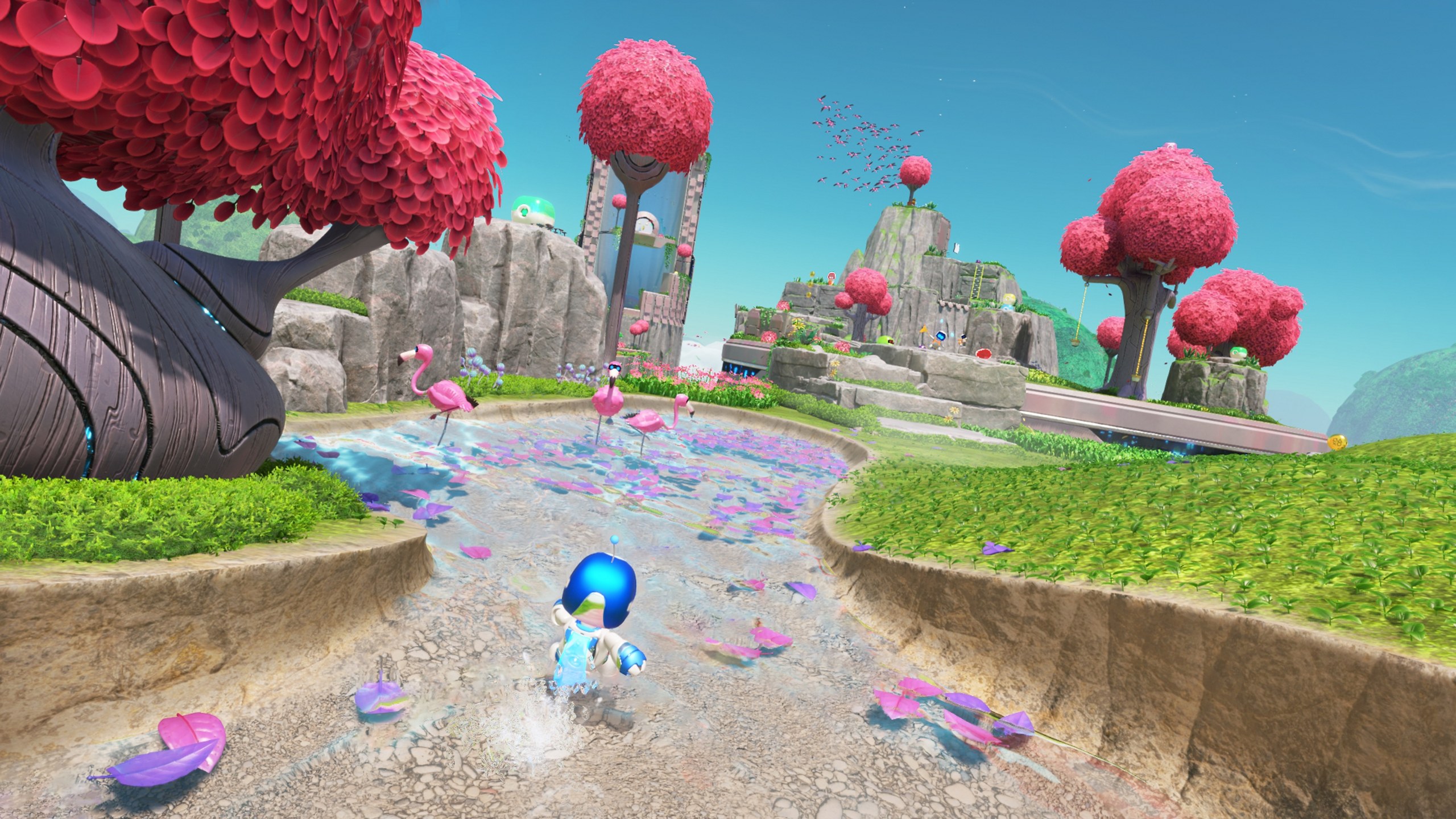 Astro Bot – Astro läuft durch eine bunte Welt mit roten Pilzbäumen