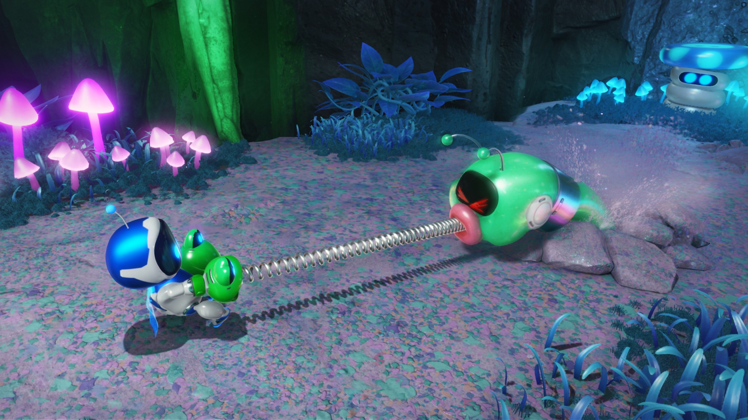 Astro Bot – Astro zieht mit einer Feder an einer grünen Raupe