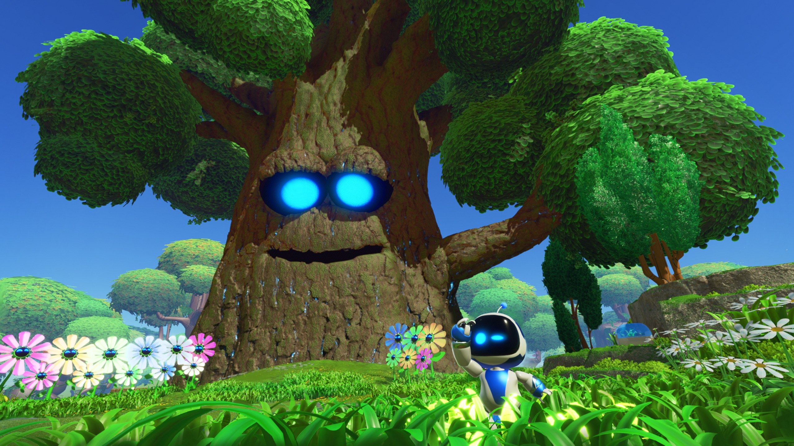 Astro Bot – Astro vor einem Baum mit leuchtenden Augen