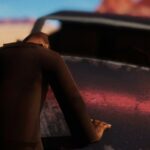 El Paso, Elsewhere – Figur vor einem Auto in der Wüste