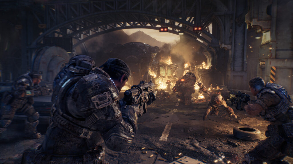 Gears of War: E-Day – Marcus Fenix und Dom Santiago kämpfen sich mit Bravo Squad unter einer brennenden Brücke durch die Locust