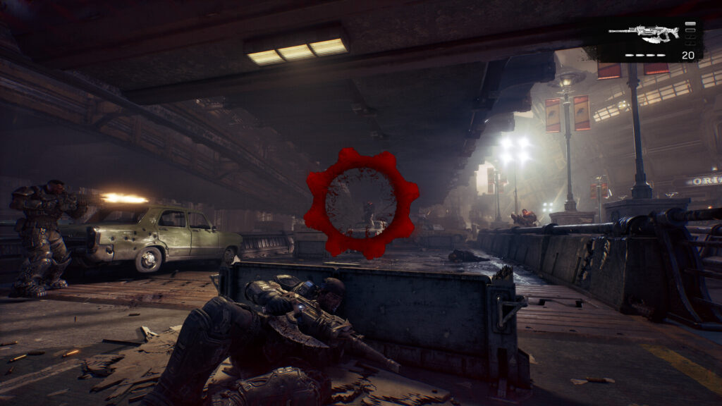 Gears of War: E-Day – Soldat zielt aus der Deckung, rotes Gears-Fadenkreuz vor einem Autowrack
