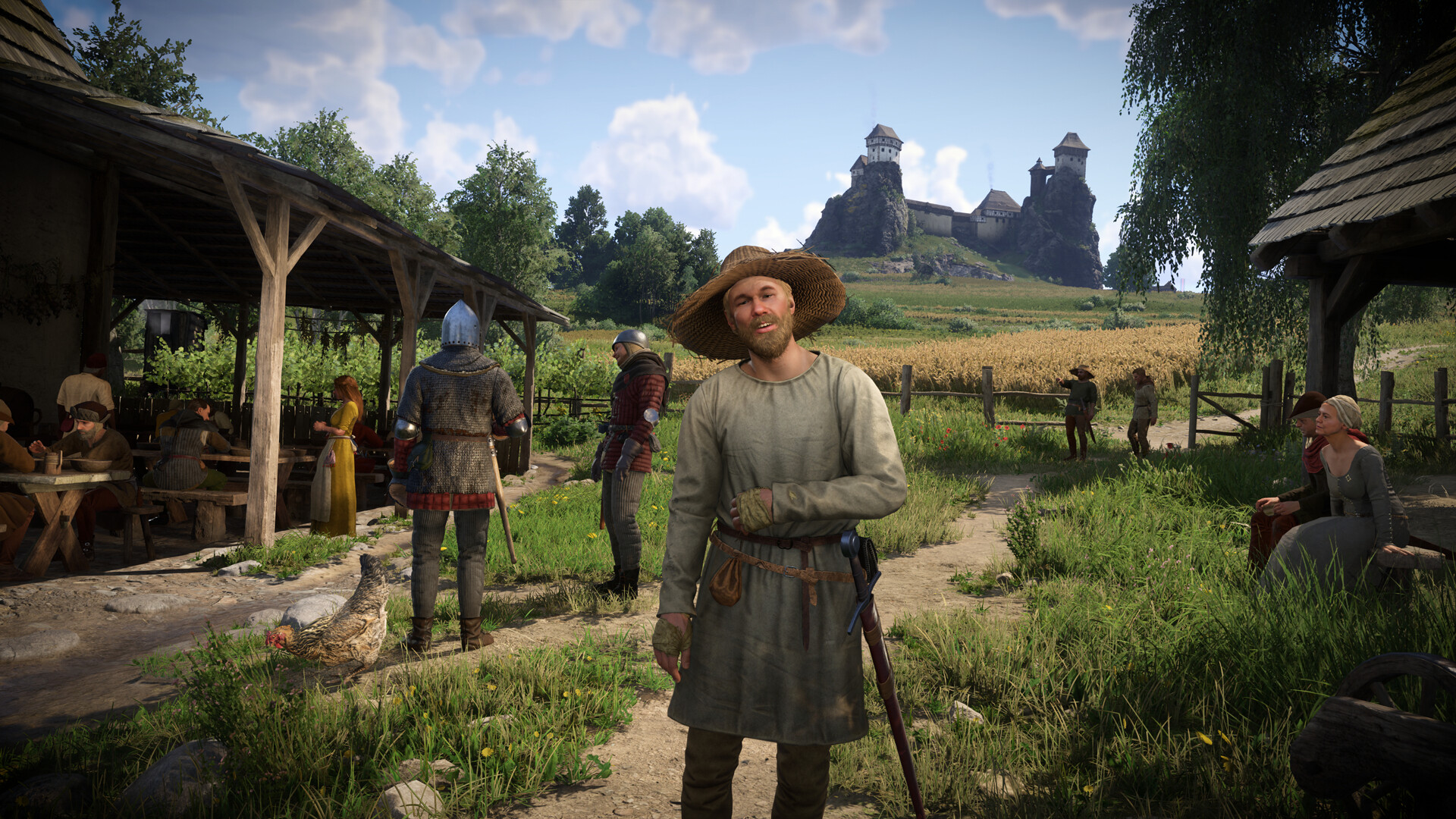 Kingdom Come: Deliverance II Screenshot: Dorf mit Burg im Hintergrund