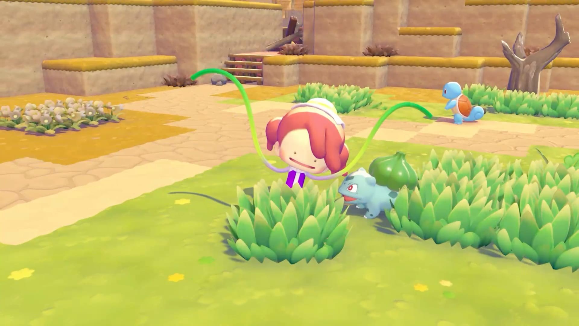 Pokémon Pokopia – Ditto lässt mit Ranken das Gras wachsen, daneben Bisasam und Schiggy