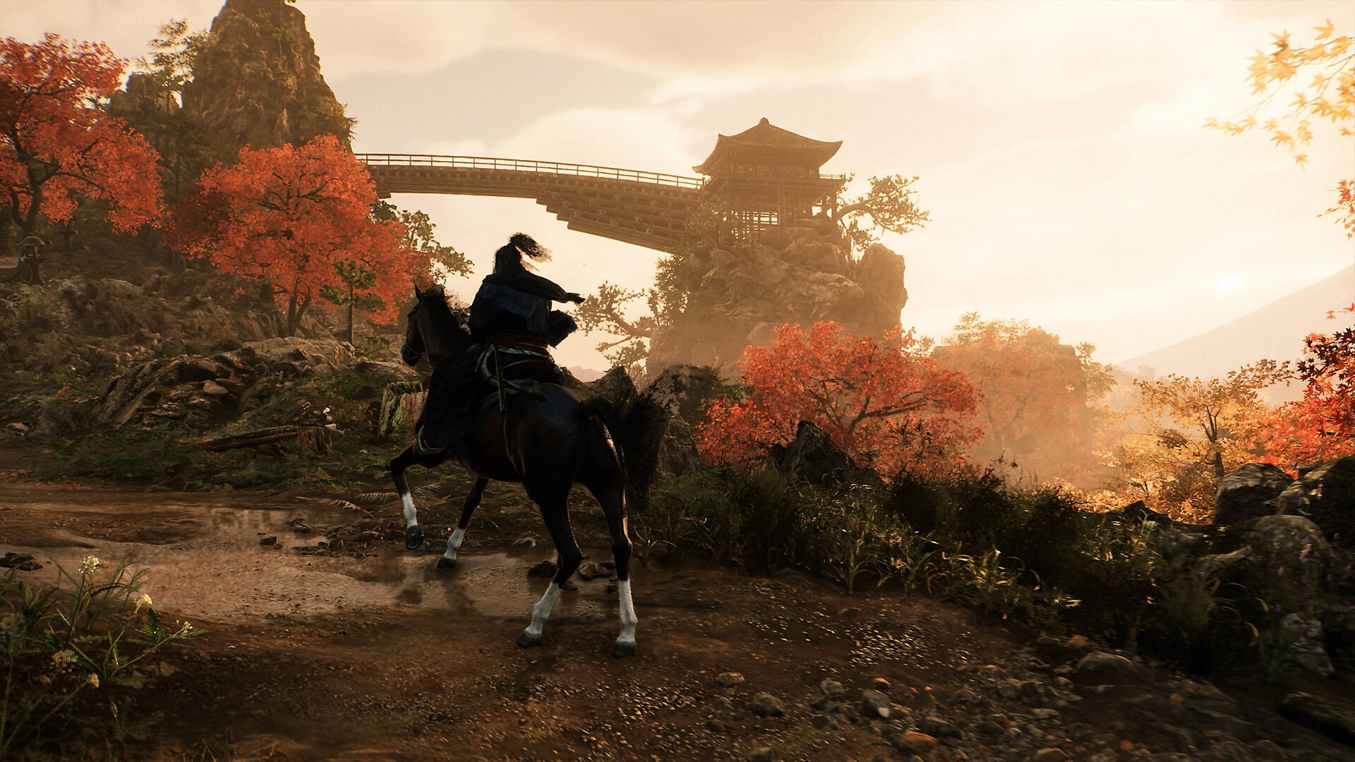 Rise of the Ronin – Reiter vor einer Brücke mit Herbstlaub