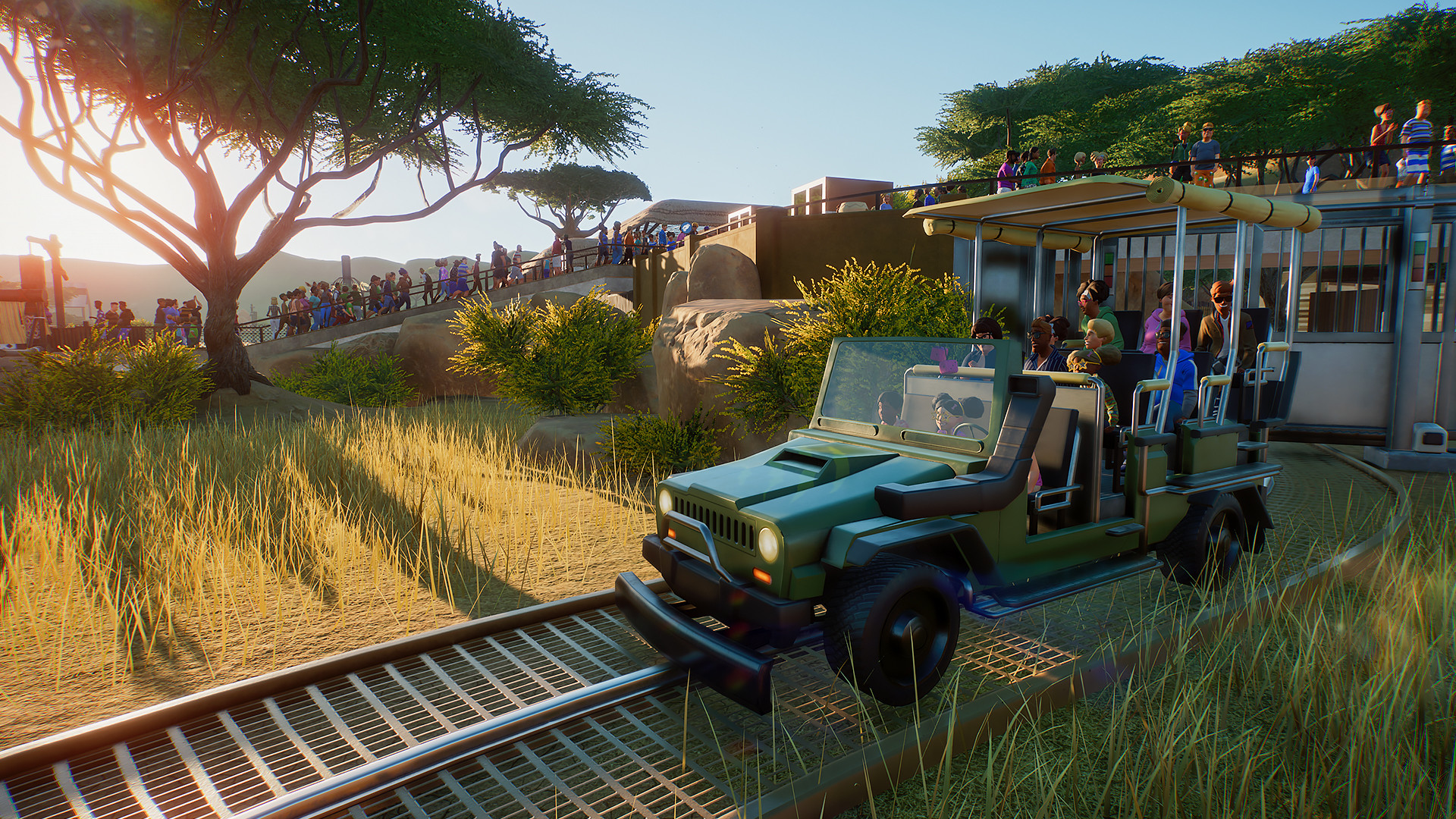 Planet Zoo: Besucher fahren mit einem Safari-Jeep durch die Savanne