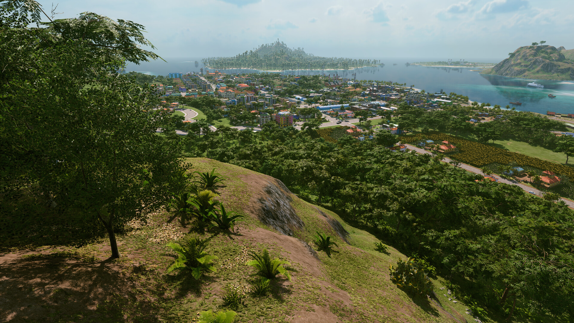 Tropico 7 Screenshot: Blick vom Hügel über Küste und Inseln